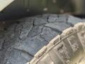 Close-up of a worn tire from a 2017 Ford Transit showing tread pattern and fine details of the rubber surface
