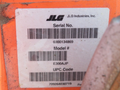A label detailing information about a 2009 JLG E300AJP including the serial number model number and UPC code