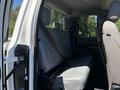 Interior view of a 2020 Ford F-350 SD showing the rear seats with grey upholstery and seat belts attached
