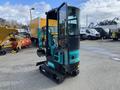 A 2024 AGT Industrial QH13R Mini Excavator featuring a compact design with tracks a hydraulic arm and an enclosed operator's cabin