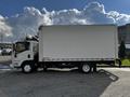 A white 2016 Isuzu NPR box truck with a large cargo area visible on the side