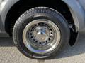 A silver 2017 Ford Transit front wheel featuring a shiny chrome hubcap and a black tire with visible tread pattern