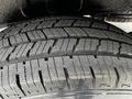 Close-up of a tire from a 2020 Mercedes-Benz Sprinter showcasing deep treads and a sturdy build