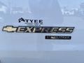 A 2014 Chevrolet Express vehicle badge displays the word EXPRESS and the brand logo along with the word STABILITRAK