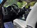 The interior of a 2015 RAM 5500 featuring a driver's seat with a steering wheel dashboard and center console