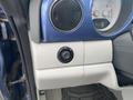 Dashboard controls of a 2007 Chrysler PT Cruiser showing a round knob and surrounding gauges