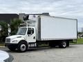 A white 2018 Freightliner M2 106 box truck with a refrigerated unit on top parked on a street