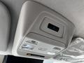 Interior ceiling light panel of a 2023 Ford Transit featuring two lights and a switch