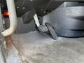 The image shows the floor area of a 2022 Freightliner Cascadia with a focus on the brake pedal and a section of the floor mat