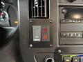 A control panel featuring a power level selector and indicator lights inside a 2020 Chevrolet Express van