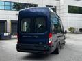 2017 Ford Transit 350 van in dark blue with a large rear cargo area and tinted windows