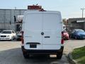 A white 2021 Mercedes-Benz Sprinter van facing the viewer with a plain rear design and Mercedes-Benz emblem on the back door