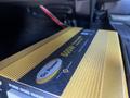 A gold and black Go Power inverter model 600W placed inside a vehicle compartment