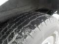 Close-up of a tire on a 2011 Chevrolet Express showing tread pattern and tread wear
