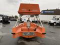 A 2008 Fassmer 20 Foot Fast Rescue boat with an orange hull and a raised cabin at the rear displaying equipment and an open deck area