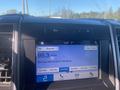 A digital display of a 2019 Ford F-150 showing the radio station 95.3 and the song title She's All I Wanna Be by Tate McRae