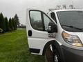 A 2018 RAM Promaster van with the driver's door open showing the interior and steering wheel