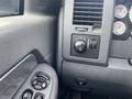 Dashboard controls of a 2008 Dodge Ram 5500 featuring buttons for lights and windows as well as gauges for monitoring vehicle performance