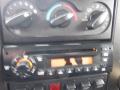 Dashboard of a 2010 International 7300 featuring climate control knobs and a stereo system with a digital display and various control buttons