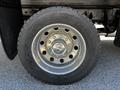 A close-up of the wheel rim of a 2015 RAM 5500 featuring a shiny metallic finish and a large tire with text indicating it is a Continental brand