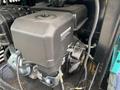 Close-up of the engine compartment of a 2024 AGT Industrial QH13R Mini Excavator showing the engine and various mechanical components