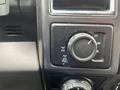 Close-up of the interior control panel of a 2016 Ford F-150 featuring a knob for selecting drive modes and settings