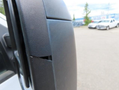 Close-up of the side mirror of a 2017 Ford F-250 SD featuring a noticeable gap at the edge of the mirror housing