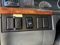 Close-up of the control panel in a 2005 Volvo VND 122 featuring buttons and switches for various functions