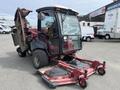 A 2012 Toro Groundsmaster 5910 with a protective cabin and multiple mowing decks positioned in the front for grass maintenance