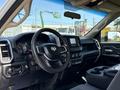 Interior view of a 2020 Ram 2500 showcasing the steering wheel dashboard and center console with various controls and screens