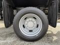 Close-up of a 2012 Dodge Ram 5500 wheel featuring a silver alloy rim and a rugged tire highlighting its tread design