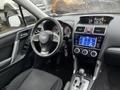 Interior view of a 2016 Subaru Forester showing the steering wheel dashboard center console and gear shifter