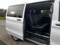 A 2018 Mercedes-Benz Metris with an open side door revealing black leather seats inside