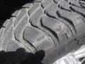 Close-up of a rugged tire tread from a 2018 Ford F-350 SD showing deep grooves and textures designed for off-road performance