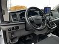 Interior view of a 2021 Ford Transit showing the steering wheel dashboard and control panel with a touchscreen display