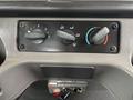 Control panel of a 2015 Freightliner M2 106 featuring knobs for temperature and airflow adjustment