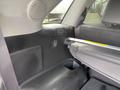 Interior view of a 2015 Kia Sorento showing the rear seating area with a folded down seat and storage compartment