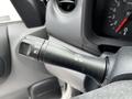 Close-up of a turn signal lever from a 2020 Nissan NV200 with marked settings for off left and right signal indicators