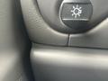 A close-up view of the dashboard controls for a 2004 Ford Econoline including a switch for interior lighting