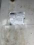 2009 Ford Econoline van with an inspection sticker attached showing details about the vehicle and inspection status