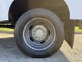 A close-up of a Michelin tire mounted on a 2009 Ford F-550 showing the wheel rim and lug nuts