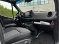 Interior view of a 2019 Mercedes-Benz Sprinter showing the driver's seat dashboard and center console with controls and storage compartments
