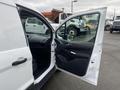 A 2017 Ford Transit Connect with an open driver's side door showing the interior and dashboard area