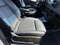 2023 Mercedes-Benz Sprinter interior showing driver's seat and passenger seat upholstered in black leather with adjustable features