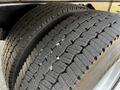 Close-up view of a tire from a 2019 International 4300 showcasing tread patterns and grooves designed for traction and durability