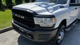 A 2019 RAM 3500 truck with a distinctive black grille and silver body featuring chrome details on the front and large headlights