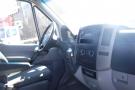 Interior view of a 2012 Mercedes-Benz Sprinter featuring a steering wheel dashboard and controls