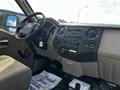 Interior dashboard of a 2008 Ford F-550 featuring a steering wheel control panel and various audio and climate controls