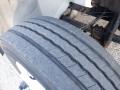 Close-up of a worn tire from a 2014 International Durastar showing visible tread patterns and wear on the rubber surface