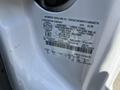 Close-up of a vehicle identification label on a 2008 Ford F-450 SD showing specifications like gross vehicle weight ratings and other details